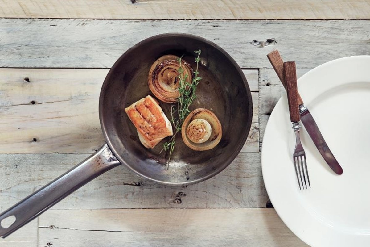 Pan-fried cod with baked onions